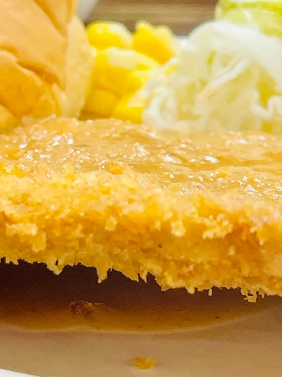 Pork cutlet with bread and strawberry jam