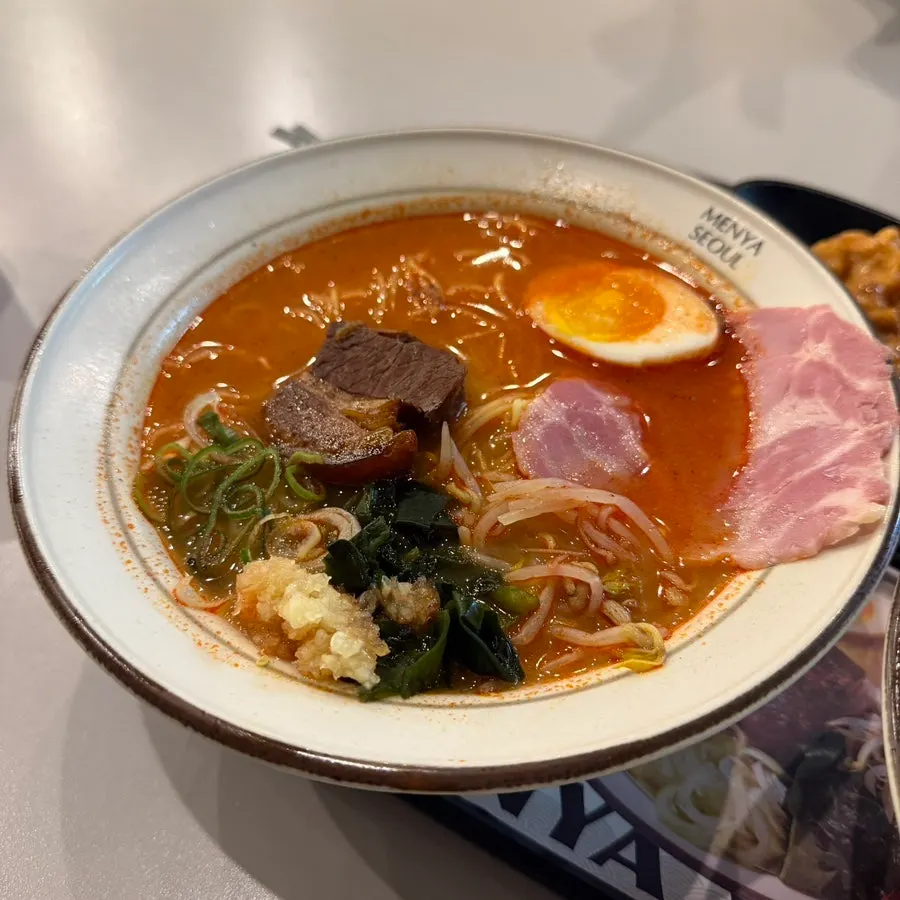 Rich spicy ramen broth with a beef-bone base