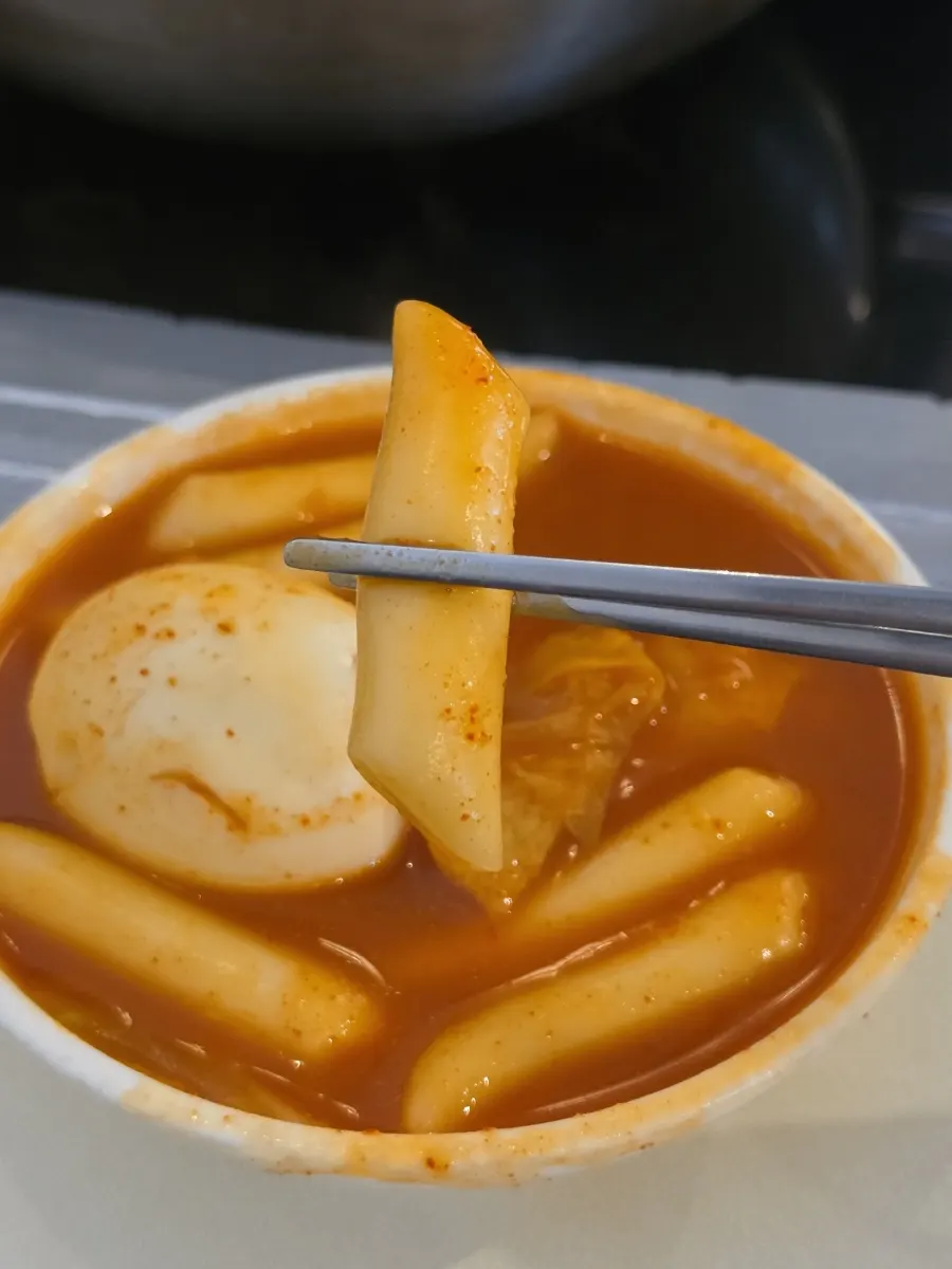 Tteokbokki with cabbage, green onion, and boiled egg