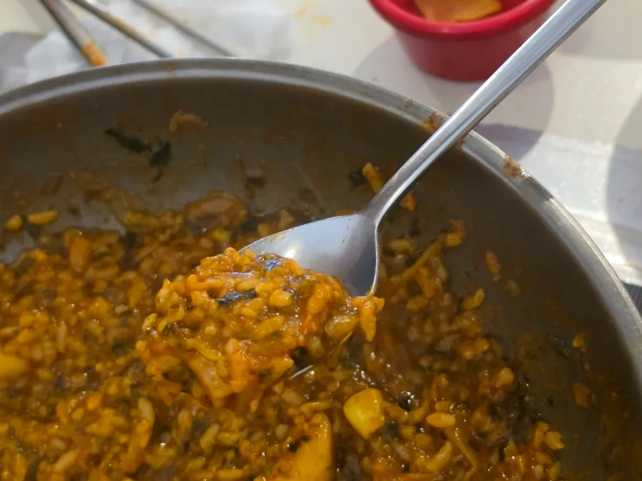 Spicy fried rice mixed with corn kernels and kimchi