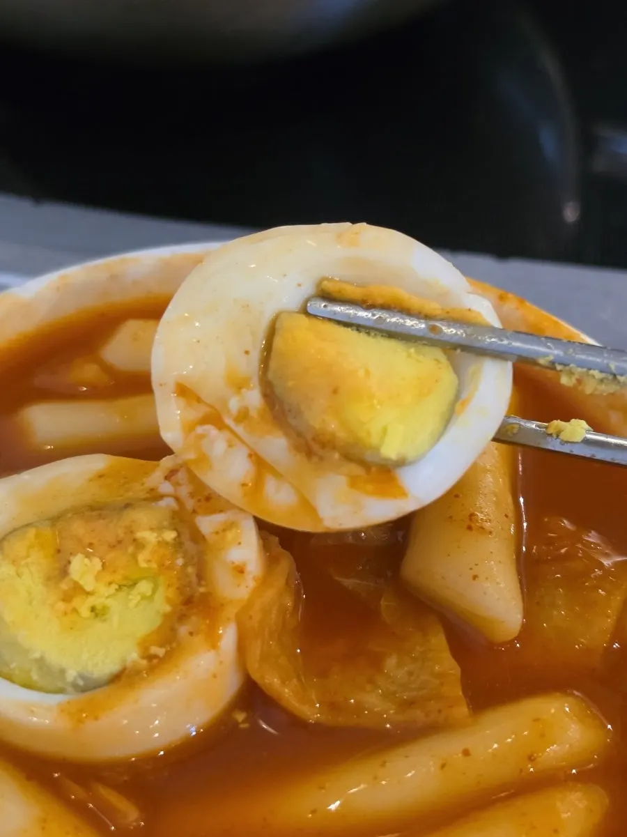 Spoonful of tteokbokki fried rice lifted up