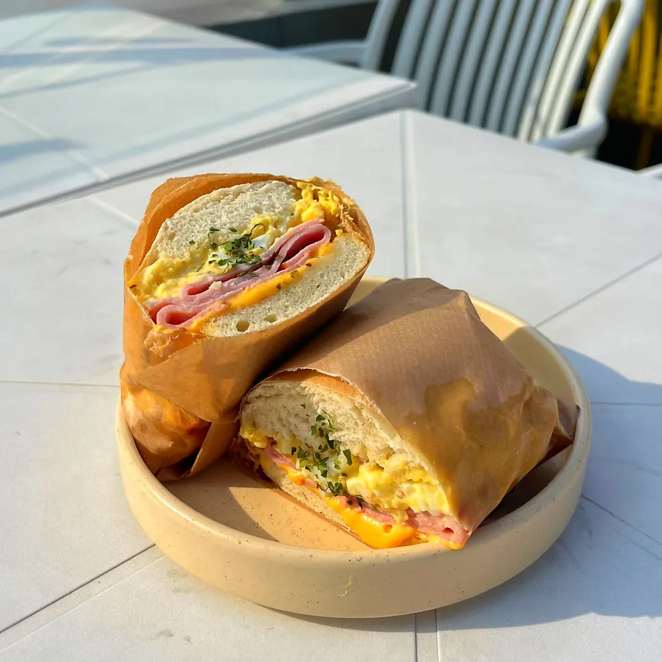 Plate with the ham egg mayo sandwich