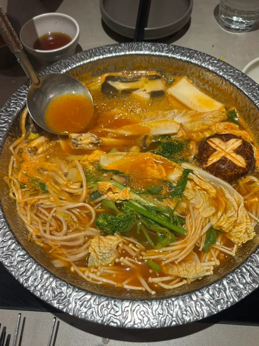 Vegetables cooking in the shabu-shabu pot