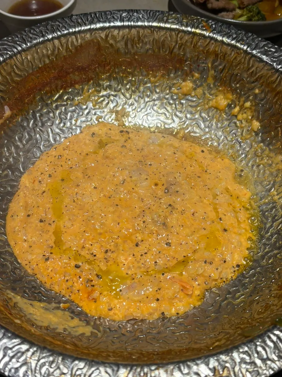 Thick rosé risotto nearing completion