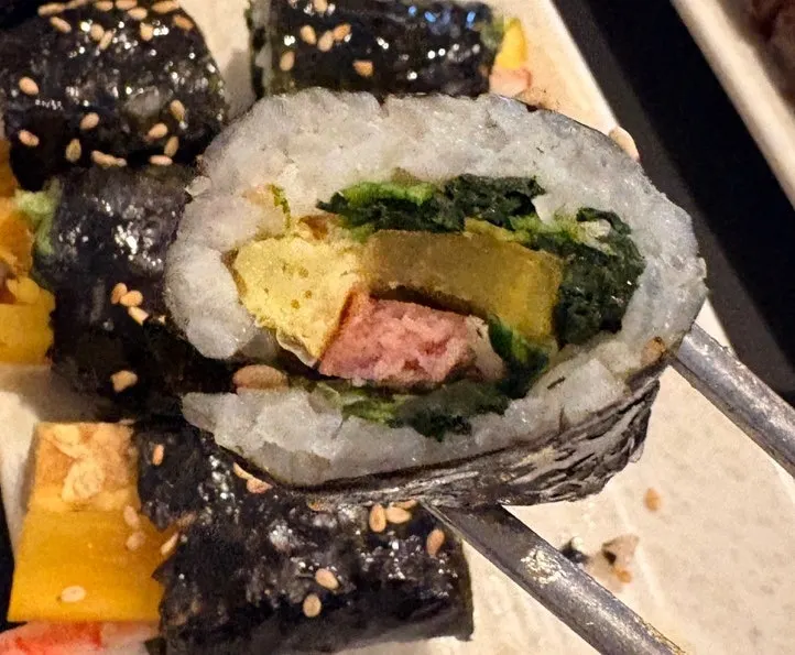 Mini gimbap served with tteokbokki