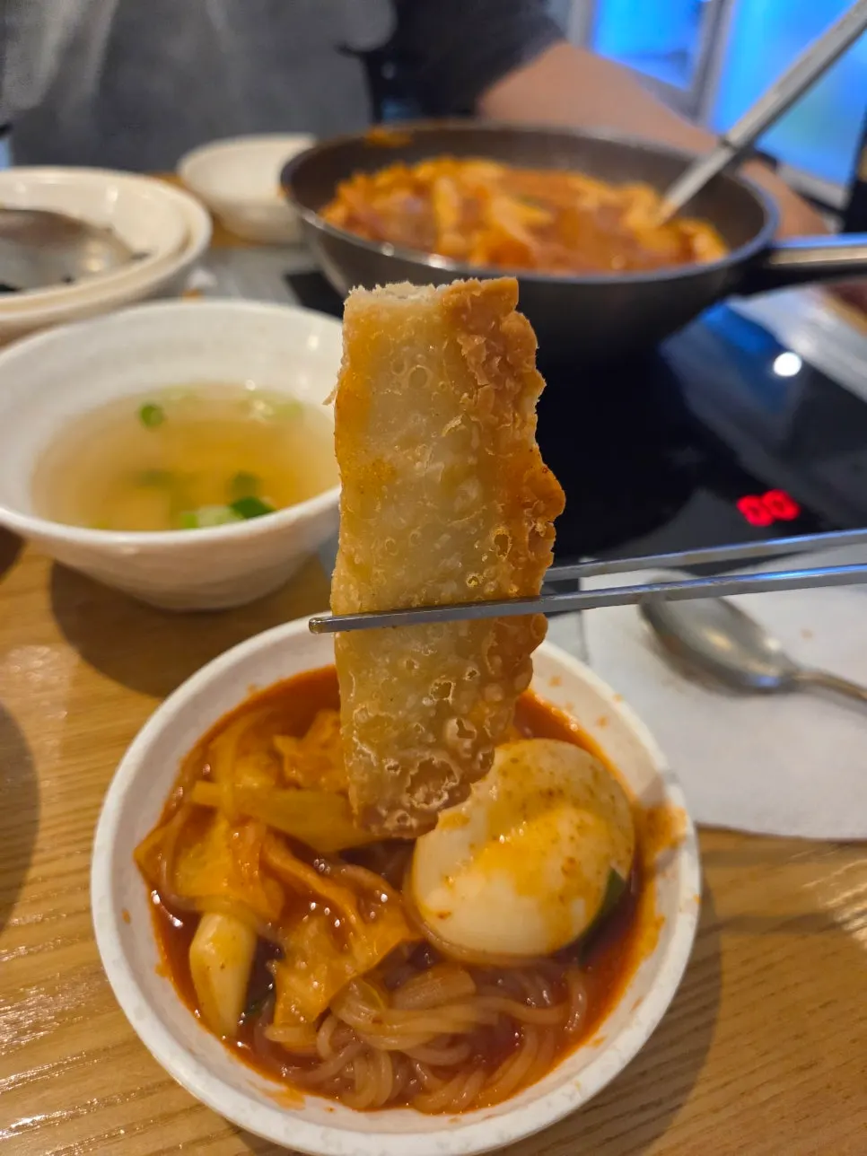 Fried dumplings placed on top of the tteokbokki