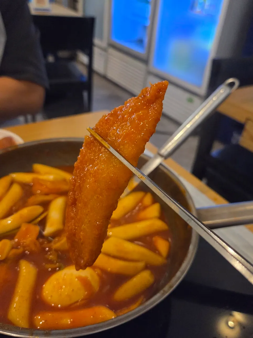 Dumpling soaked in tteokbokki broth