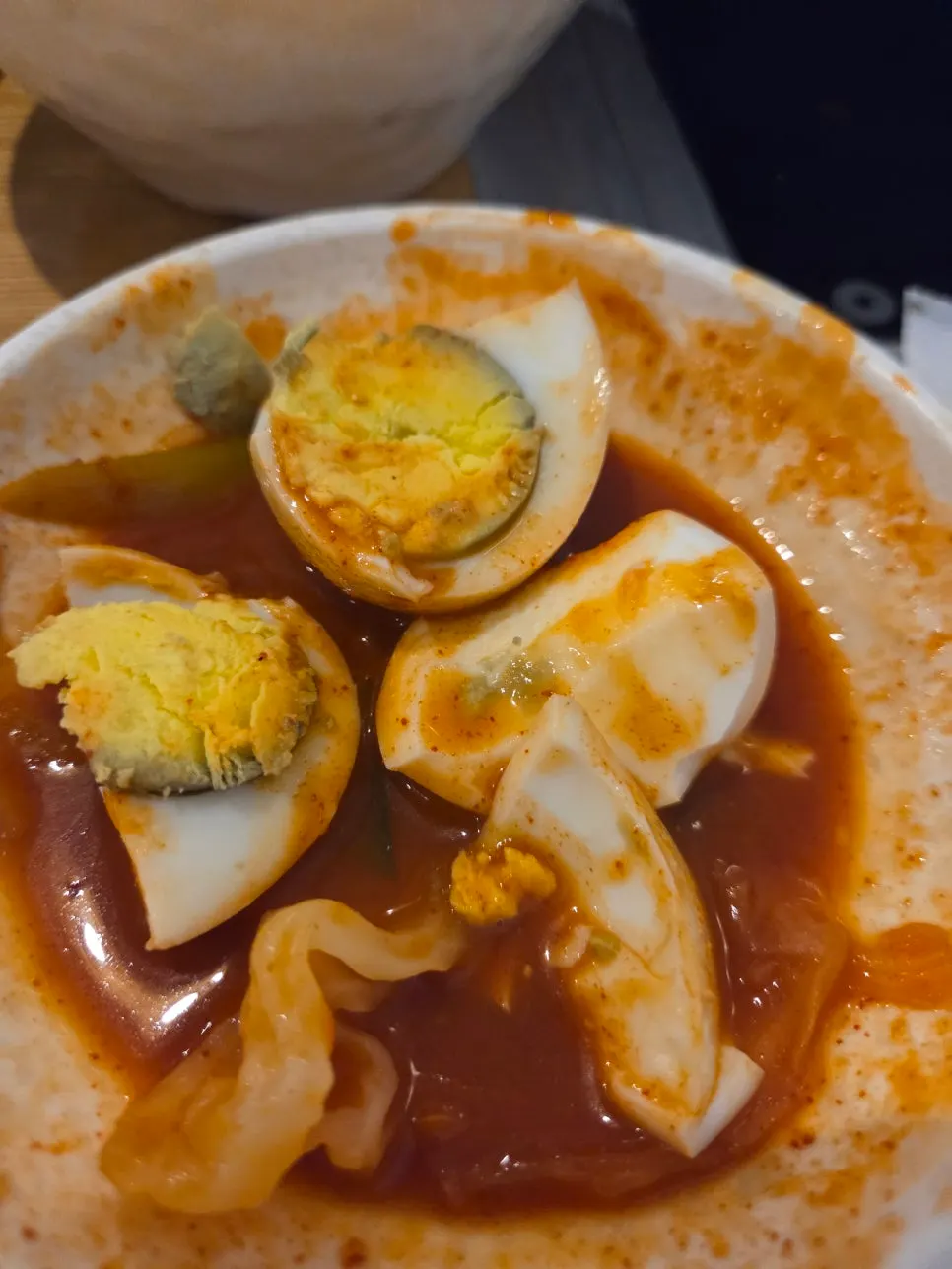 Picking up a broth-soaked dumpling