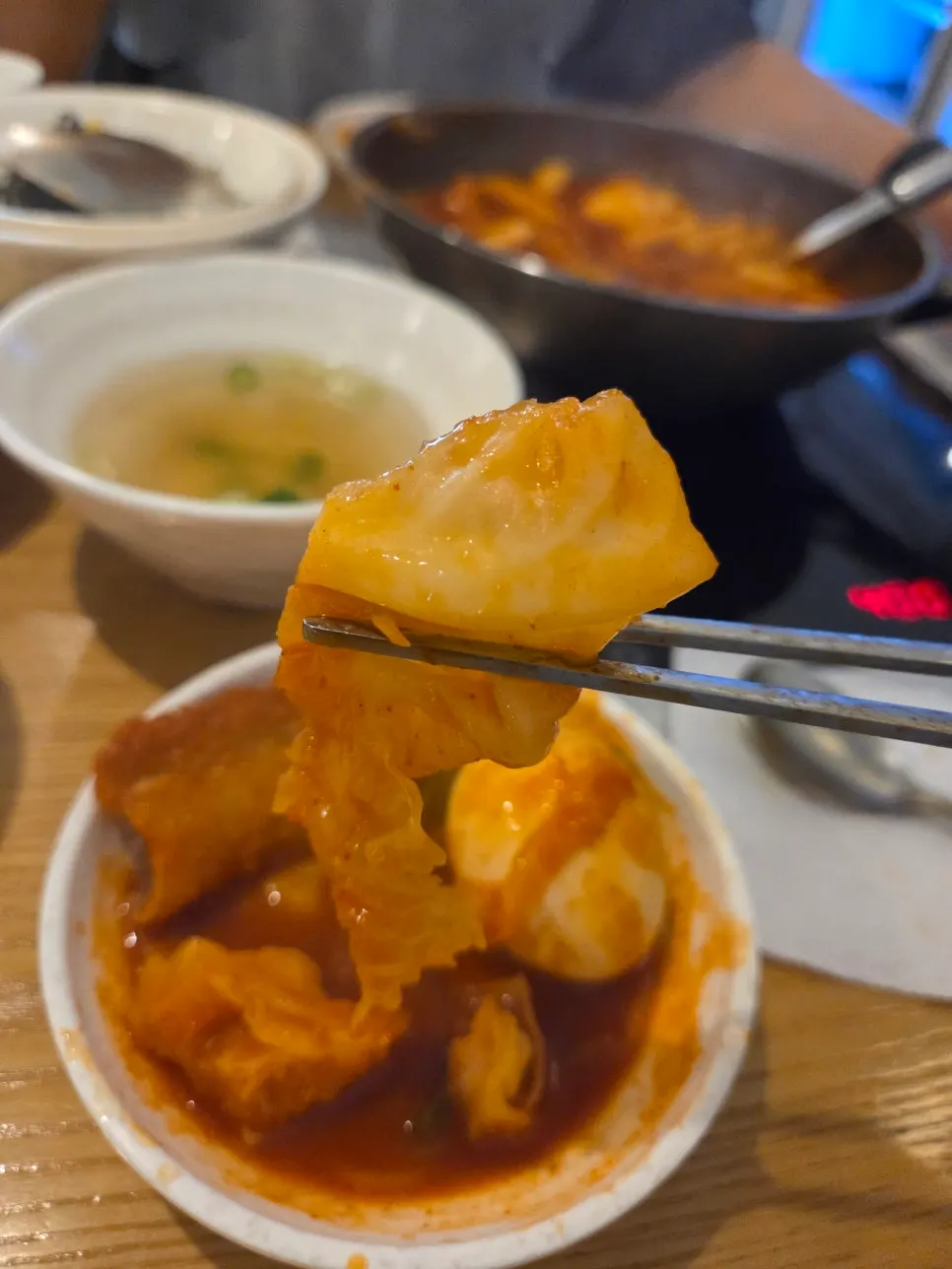 Tteokbokki with crushed egg and cabbage in the sauce