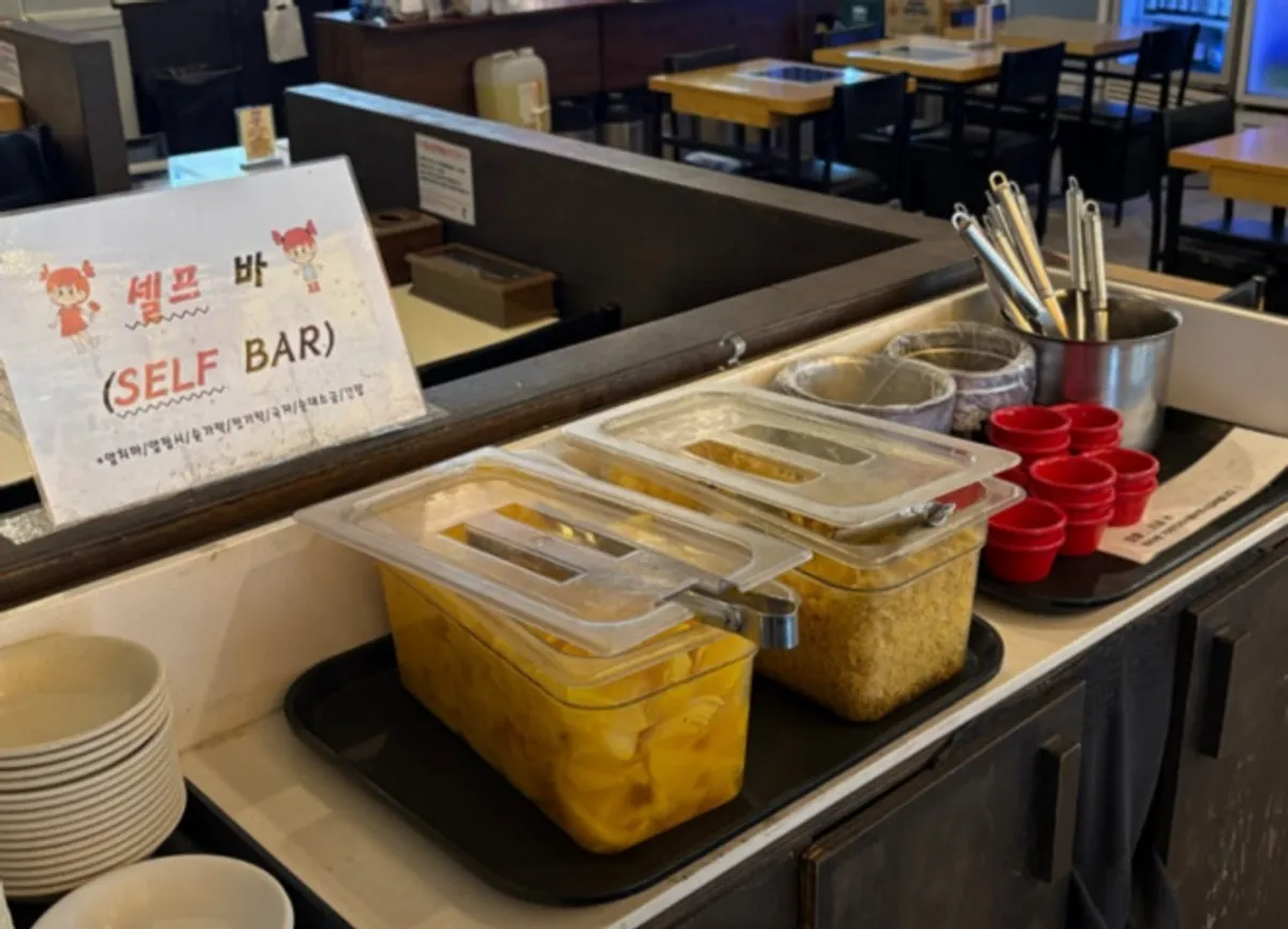 Self-serve station with pickled radish and mayo sauce