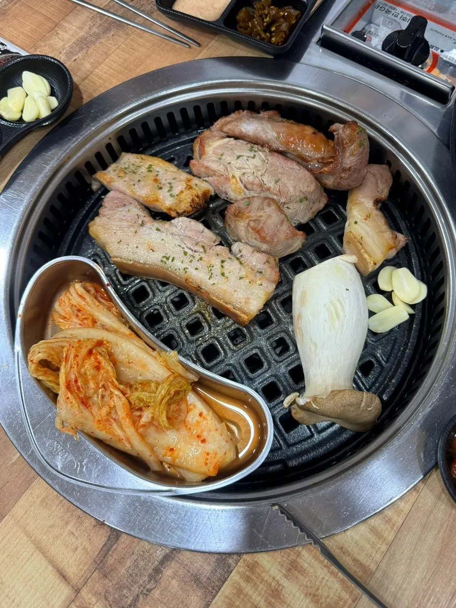 Pork grilling over charcoal