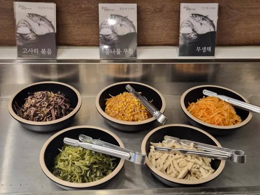 Self-service bar stocked with assorted foods