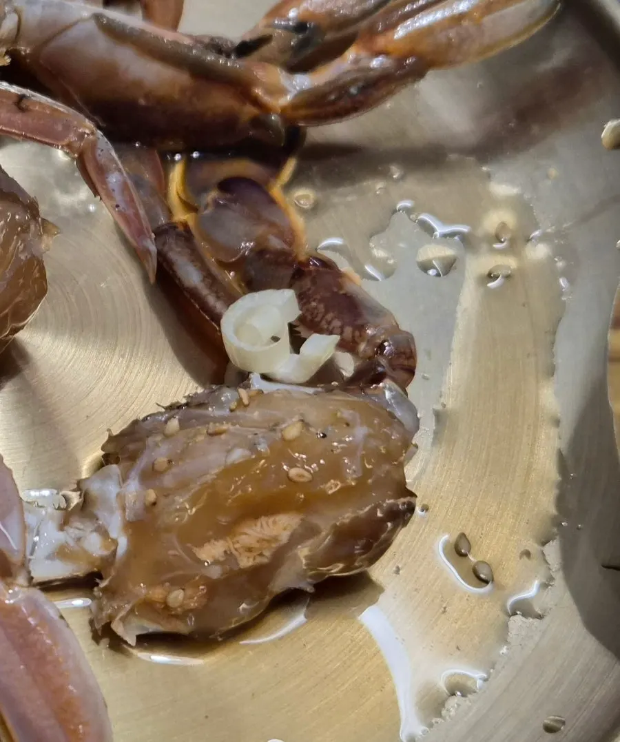 Soy-marinated crab eaten with rice