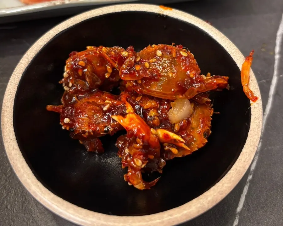Seasoned fried crab and pink sausage side dishes