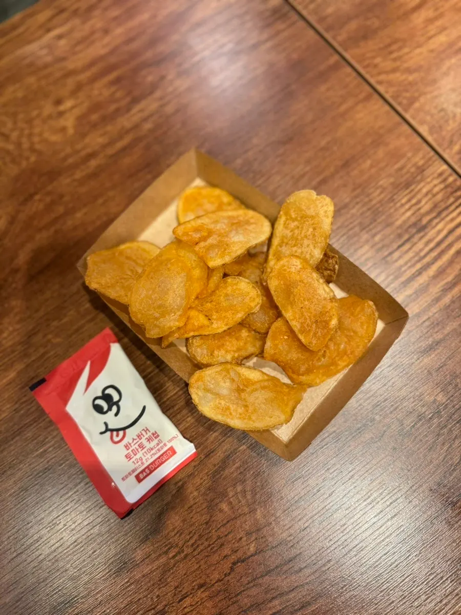 Chips served on a plate with ketchup