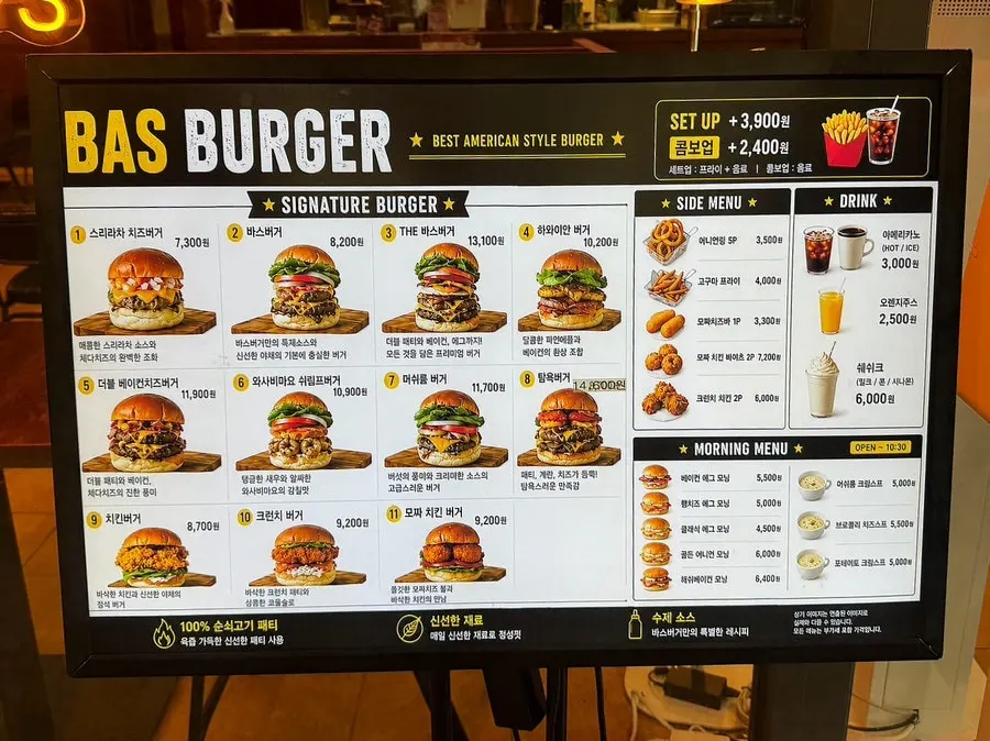 Menu board posted outside Bas Burger