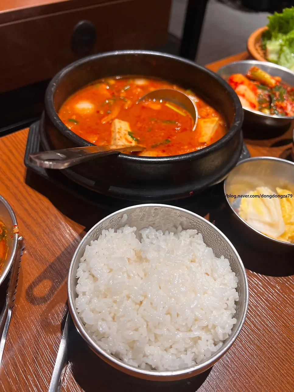 Cheonggukjang served alongside the meat