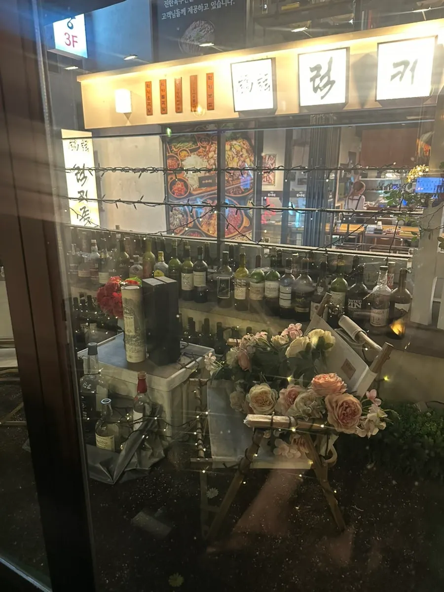 Liquor and whiskey bottles displayed on the wall