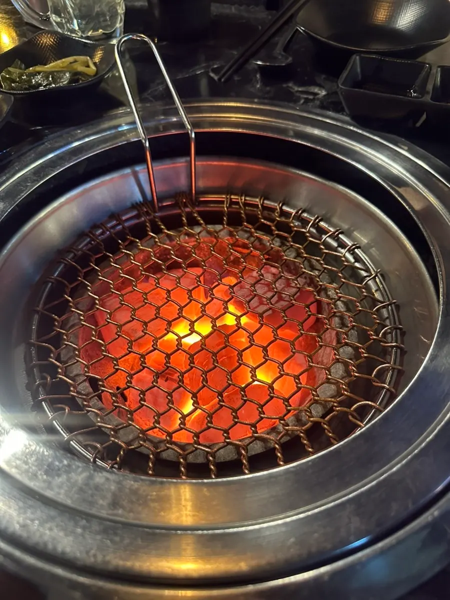 Grill loaded with strong charcoal heat