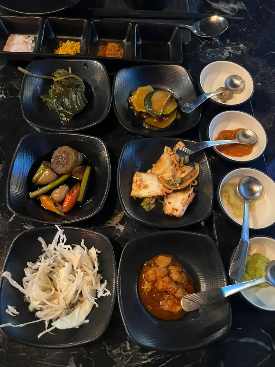 A full spread of basic side dishes at Yuklab Gangnam