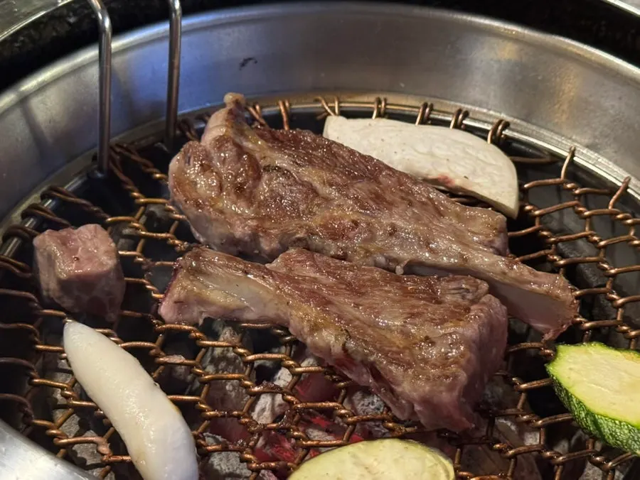 Grilled vegetables and meat on the hot plate