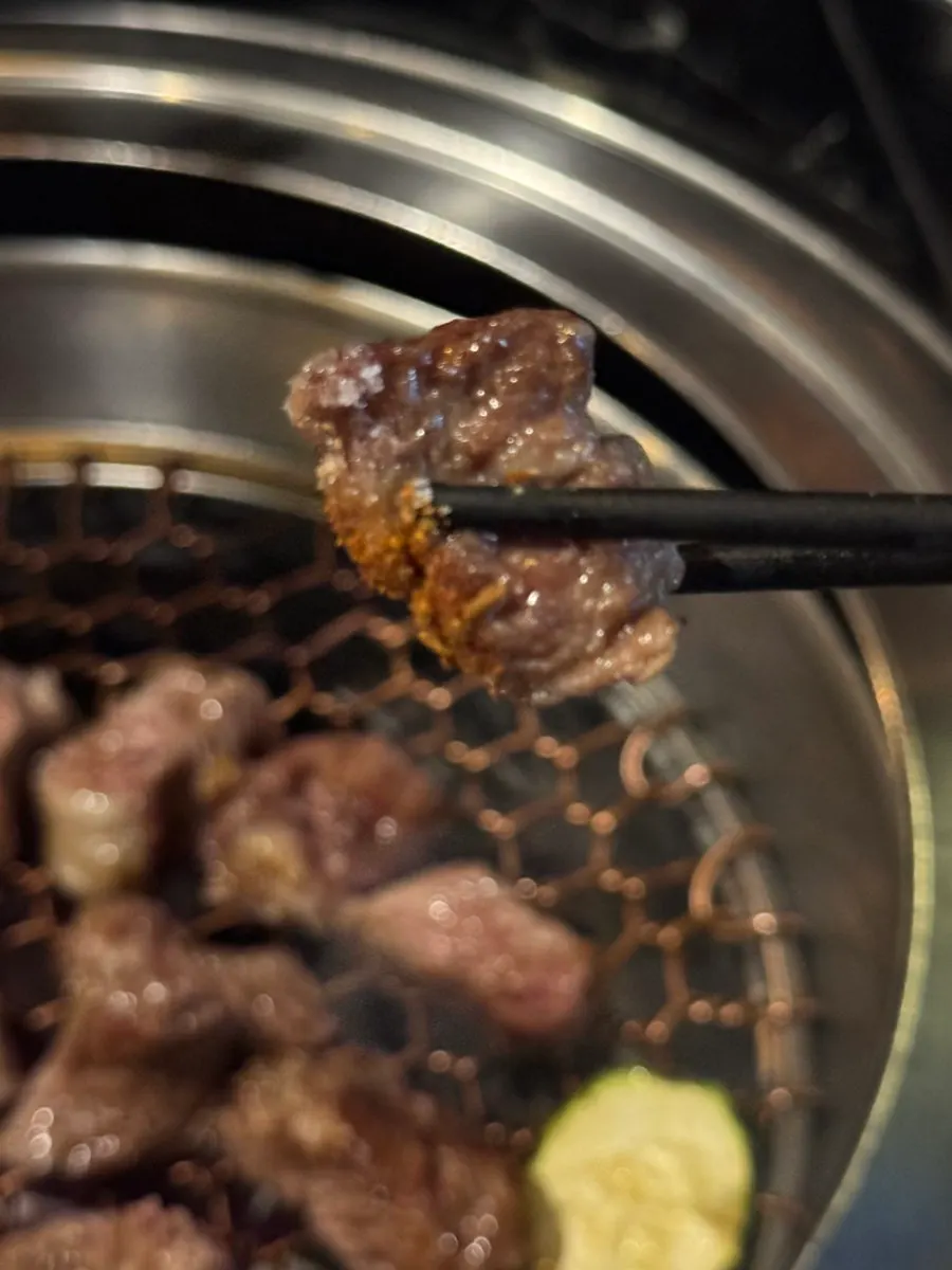 Lamb chops cooking over charcoal
