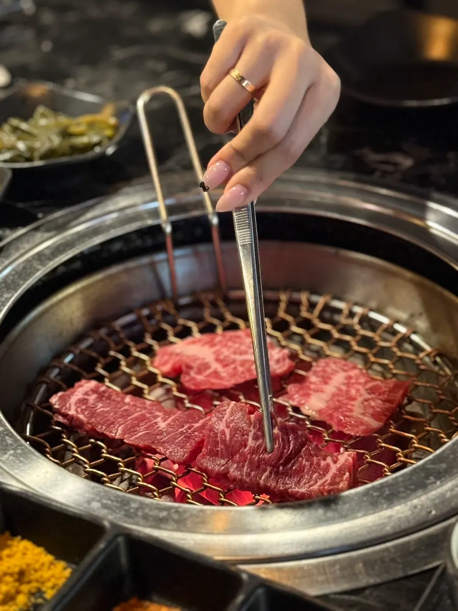 Table spread of jin-galbisal, lamb chops, and yangnyeom-galbi
