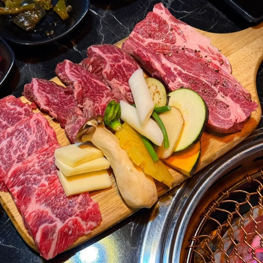 Signature charcoal-grilled meat photo at Yukrab Jongno