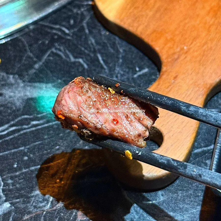 Lamb rack trimmed of bone and meat by staff