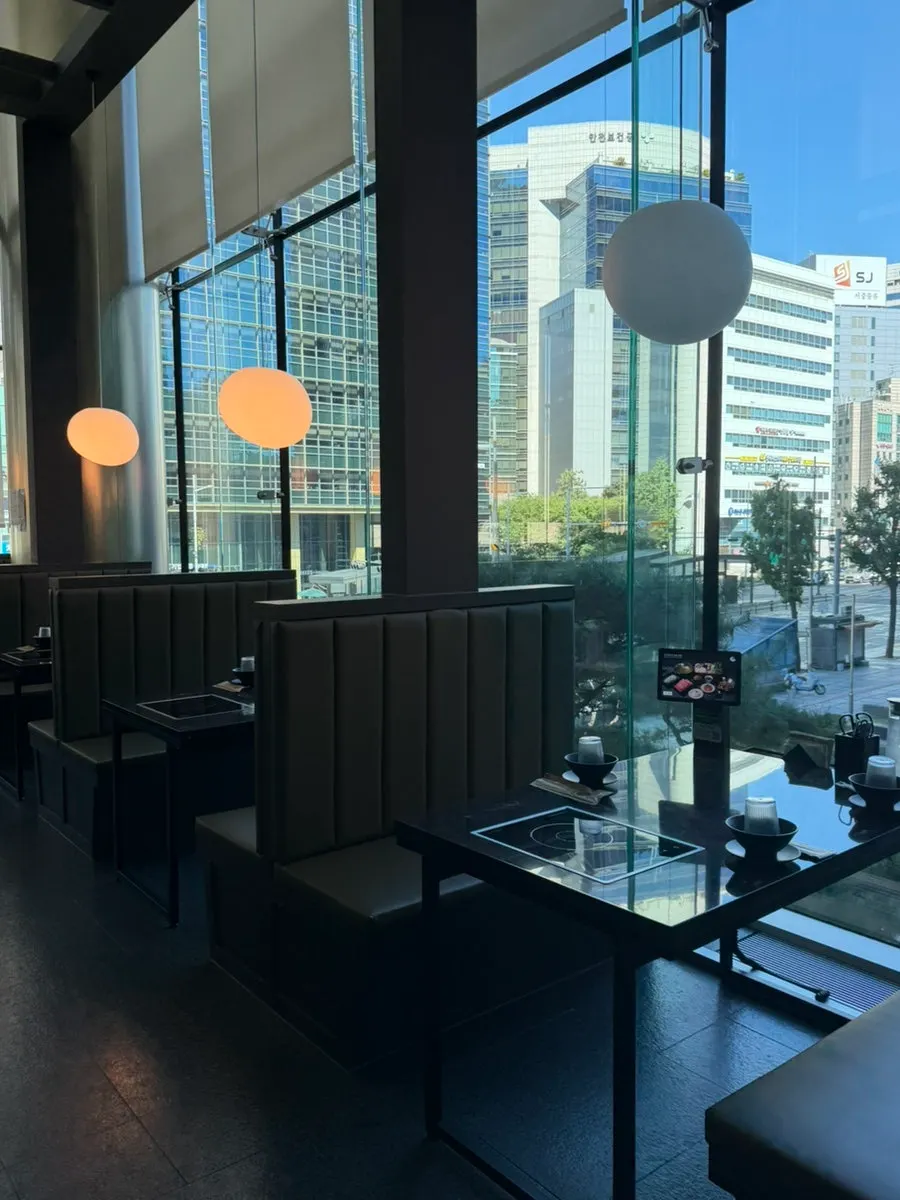 Interior of Yunseul with large floor-to-ceiling windows