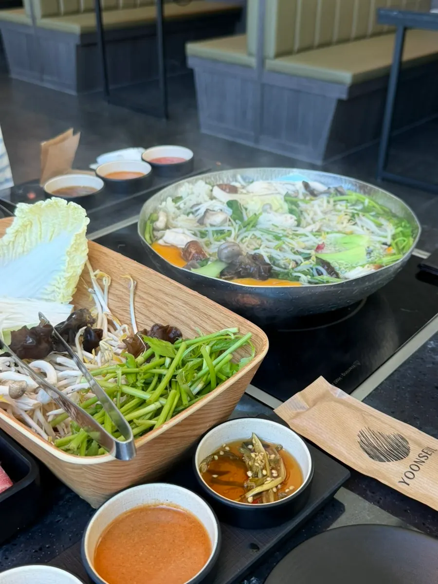 Vegetables cooking in the shabu-shabu pot