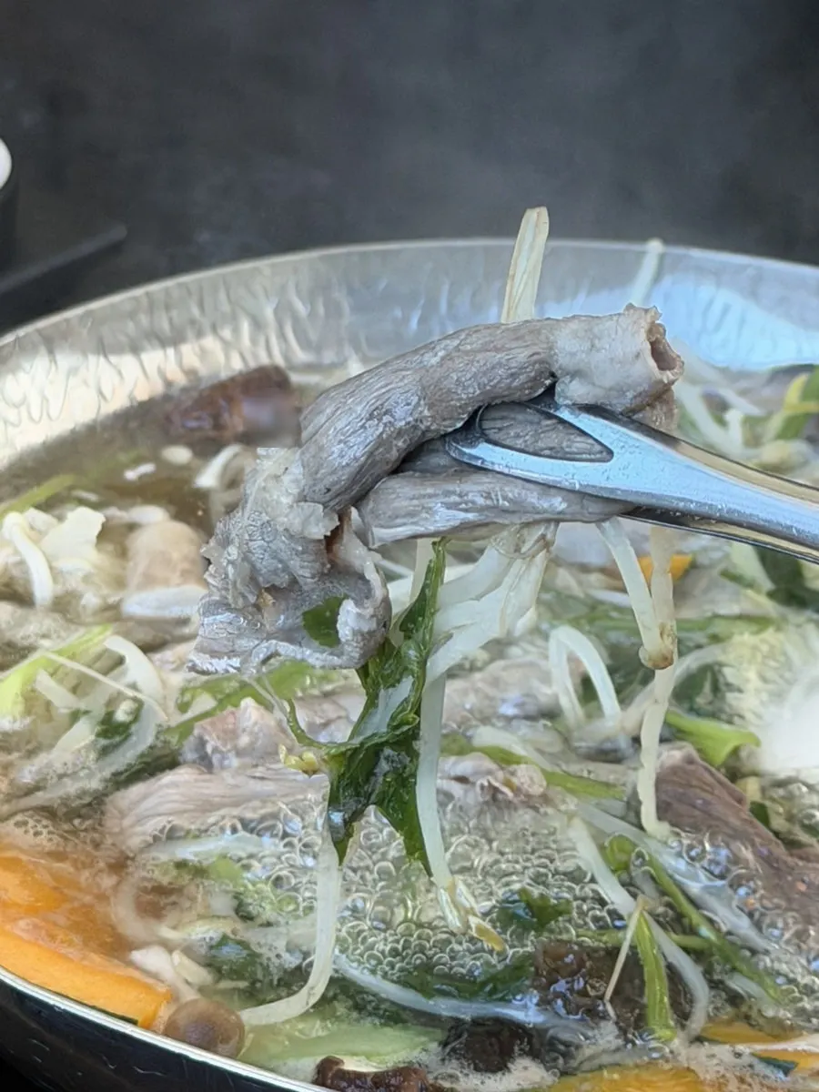 Prime chuck roll being cooked in the broth