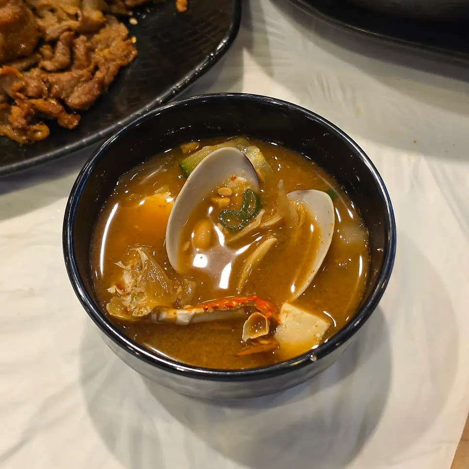 Doenjang stew bubbling in a stone pot