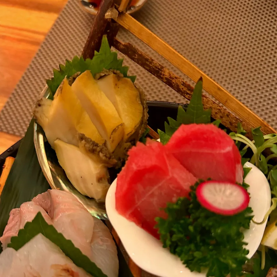 Aged assorted sashimi arranged on one plate
