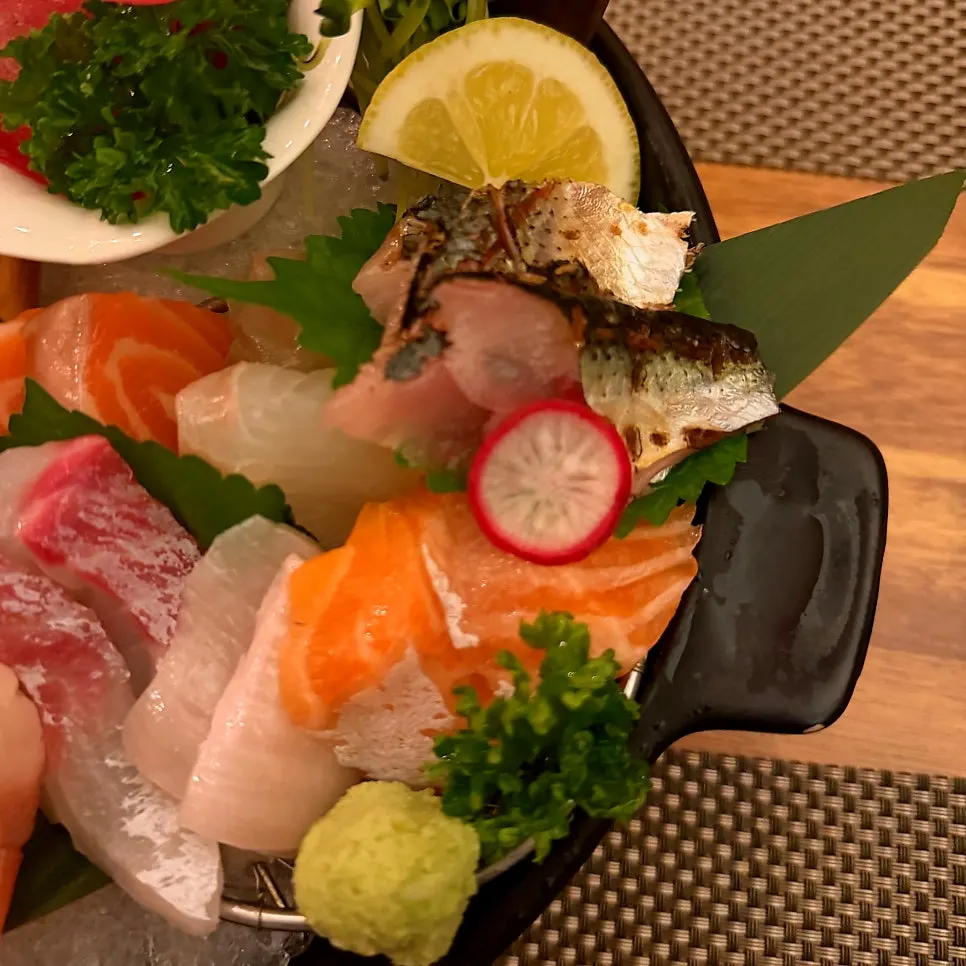 Sashimi plate showing tuna, salmon, and sweet shrimp