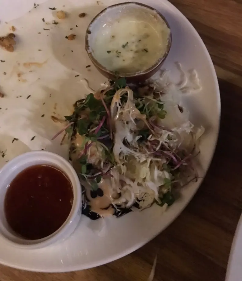 Two dipping sauces and salad served with the gara-age