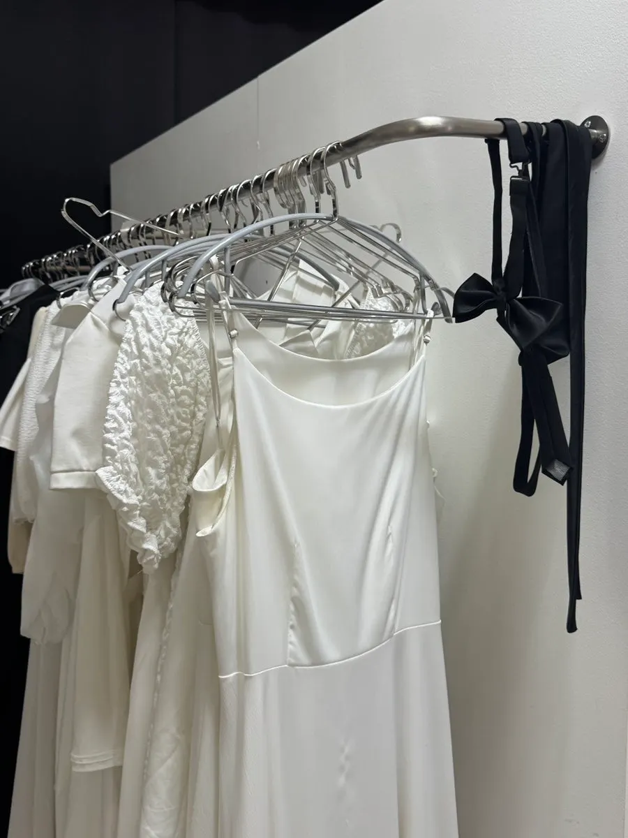 Rack of white rental dresses