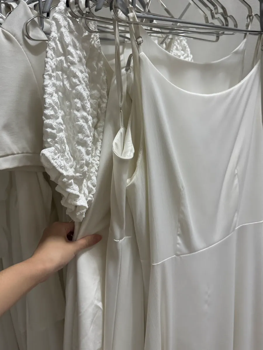 Rack of black rental outfits