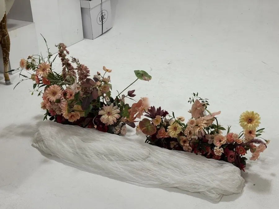 A shot with the artificial flower centerpiece in the background
