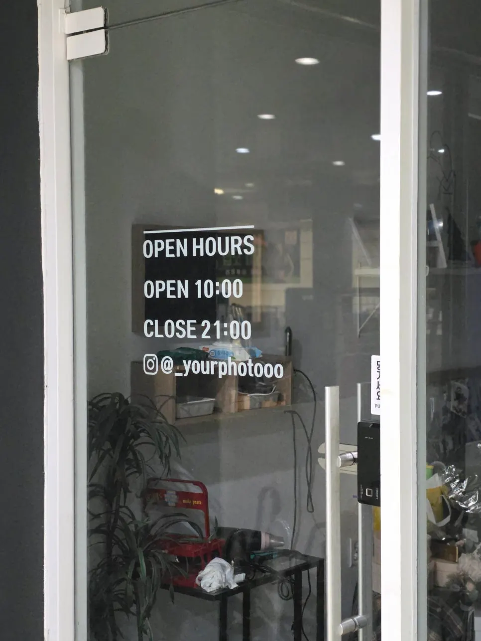 Entrance of the Your Photo store with lights off