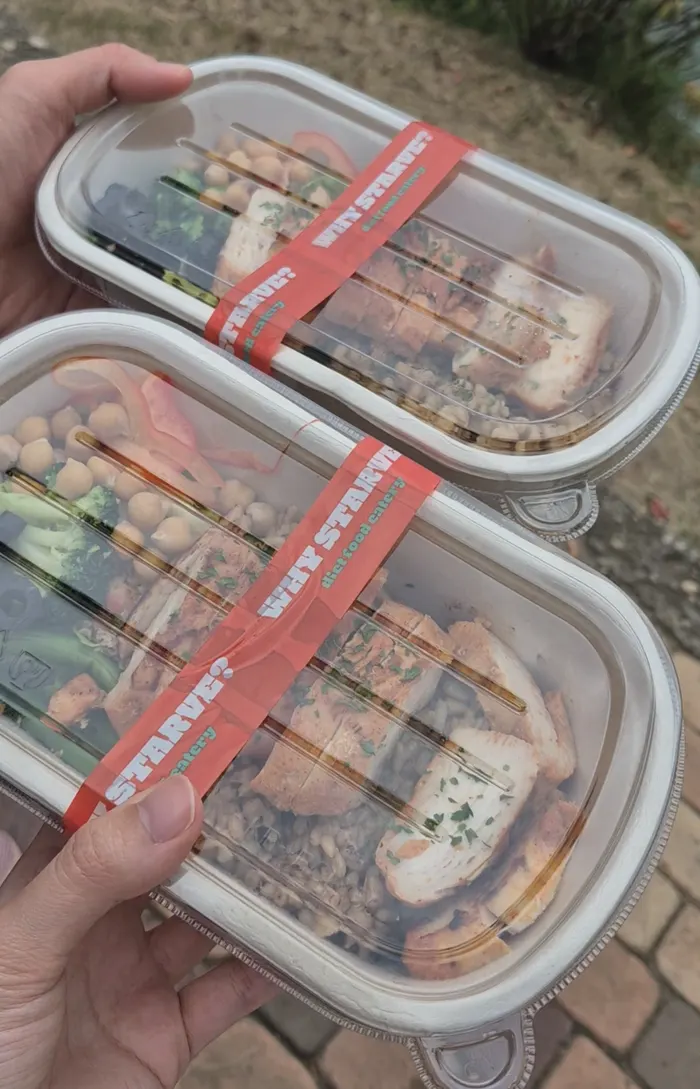 Chicken oat picnic lunch box laid out outdoors