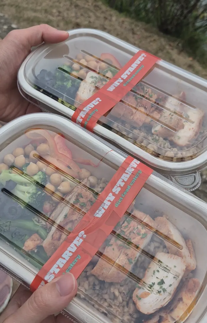Close-up of moist seasoned chicken and oat brown rice