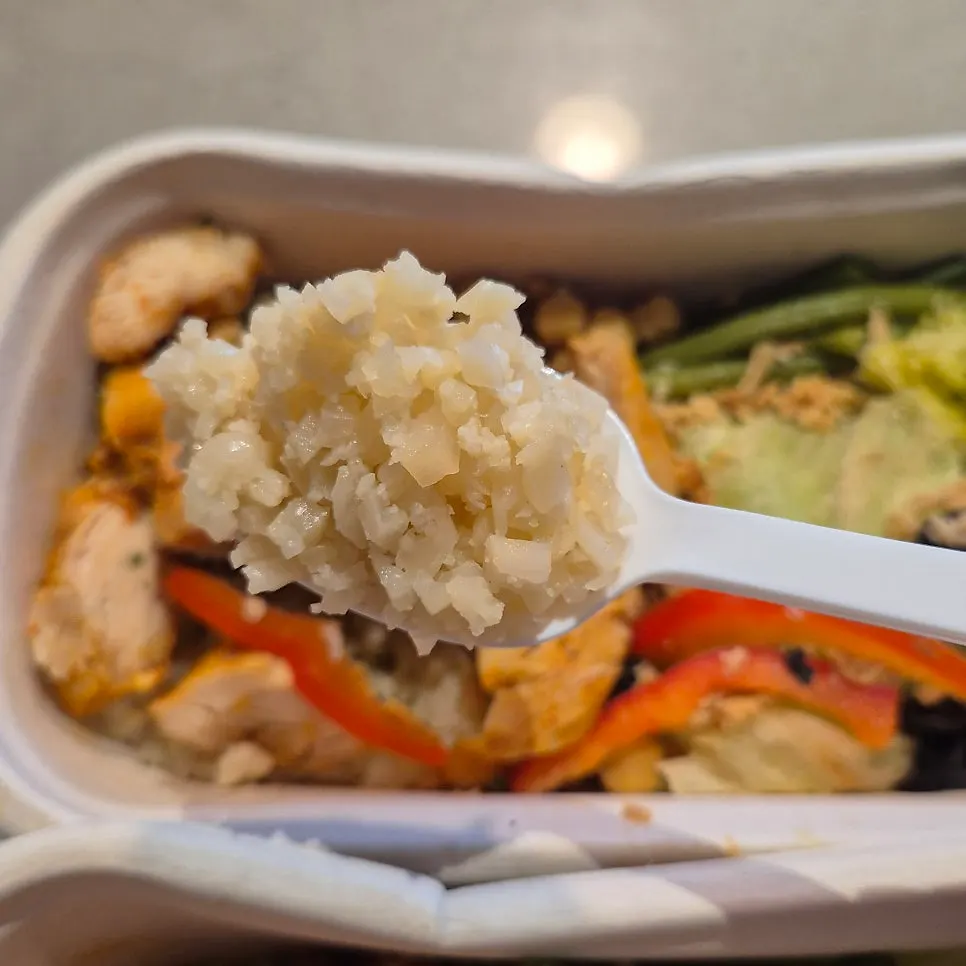 Close-up of the protein box with added cauliflower rice