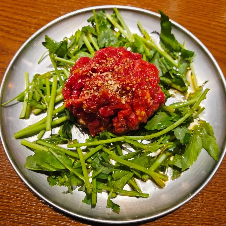 Table with minari beef tartare and cheonggukjang stew together
