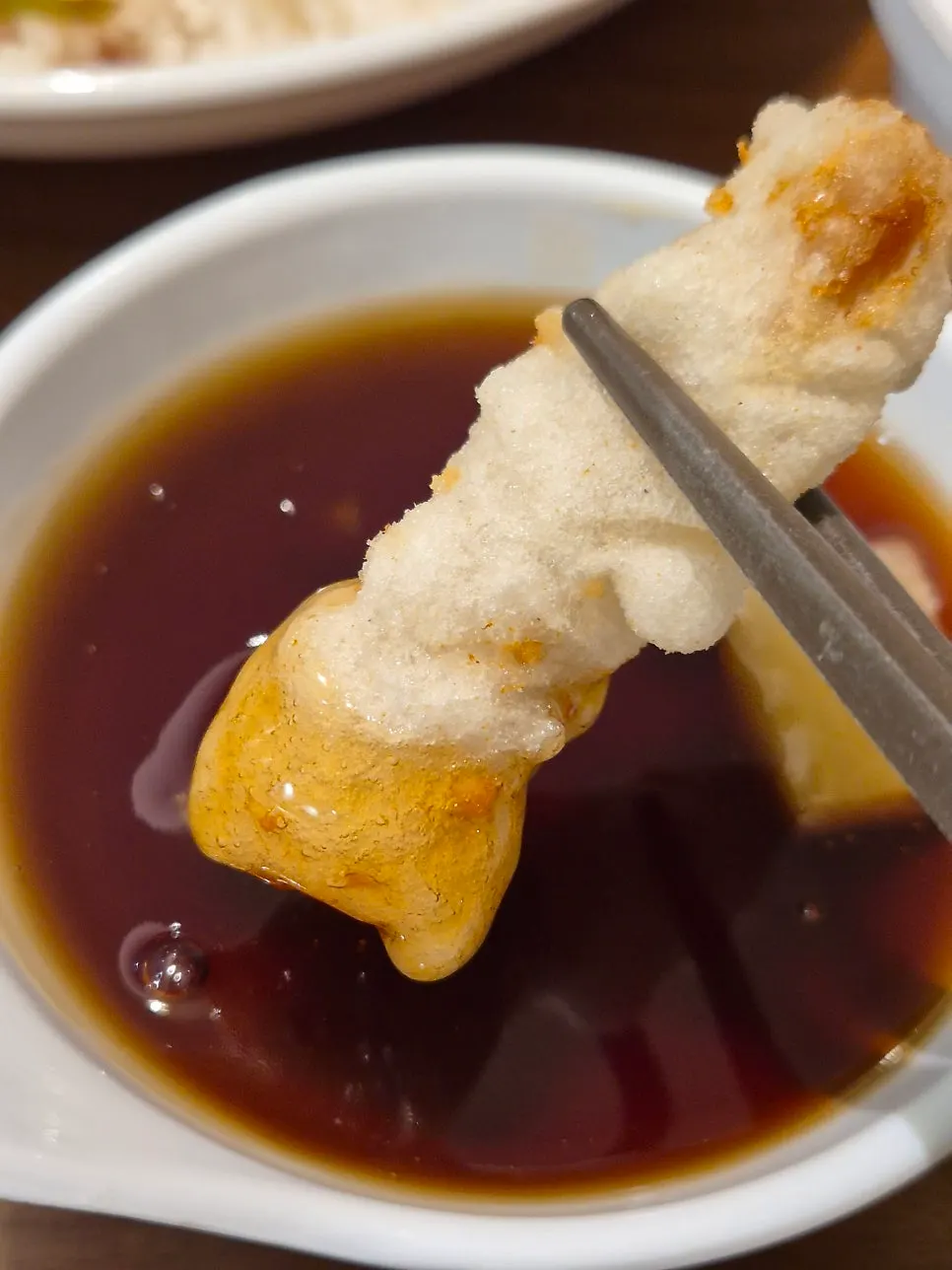 Dipping tangsuyuk into sauce