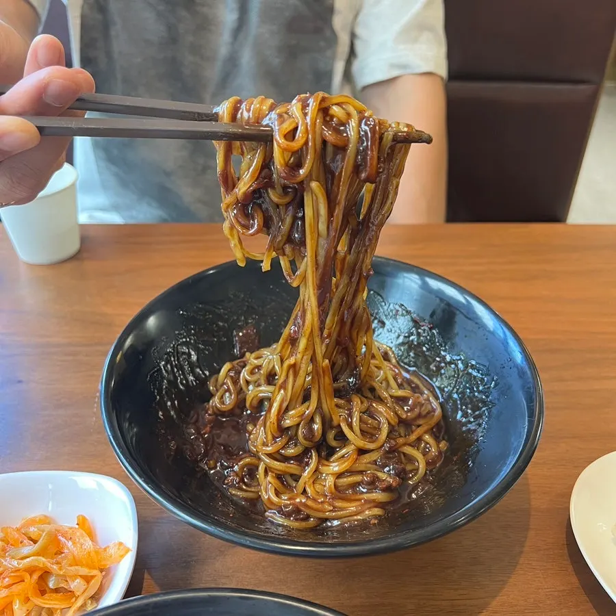Jjajangmyeon noodles mixed and ready to eat
