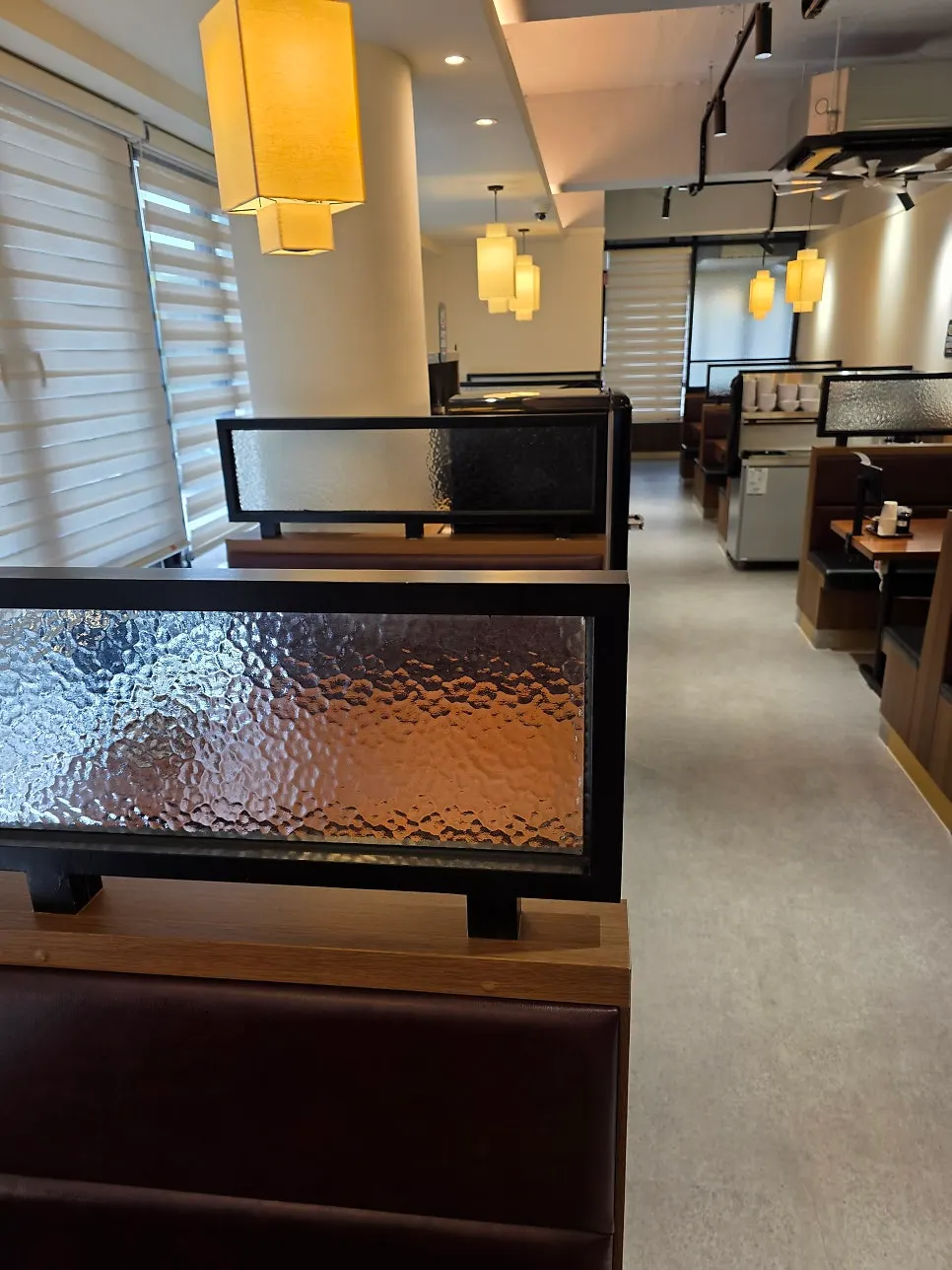 Interior of Yugwanjang's second-floor restaurant with wood-toned decor