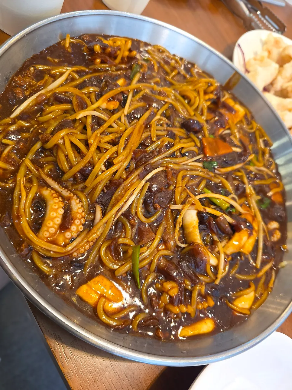 Seafood tray jjajang served on a metal tray
