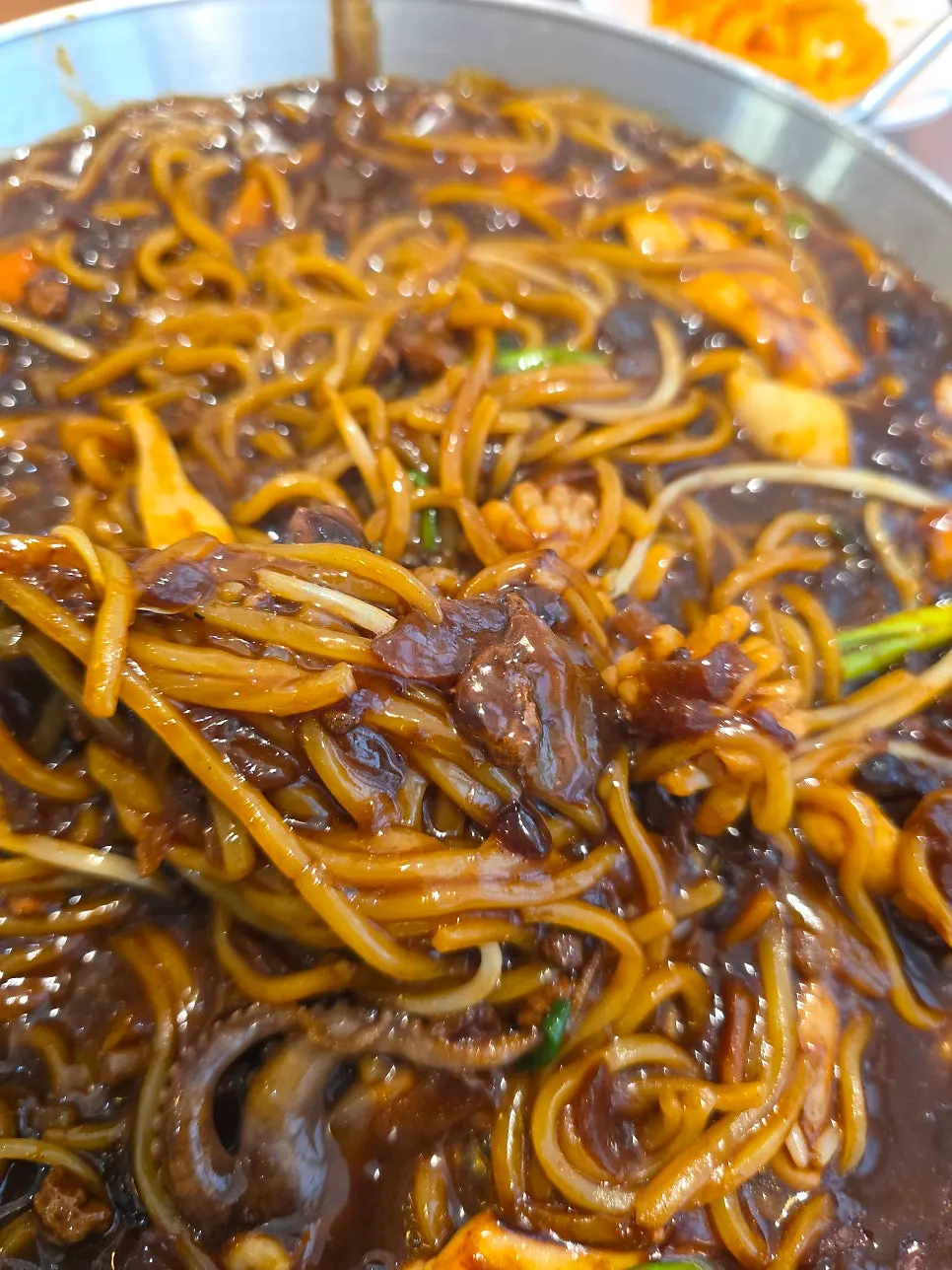 Tray jjajang sauce showing squid and shrimp