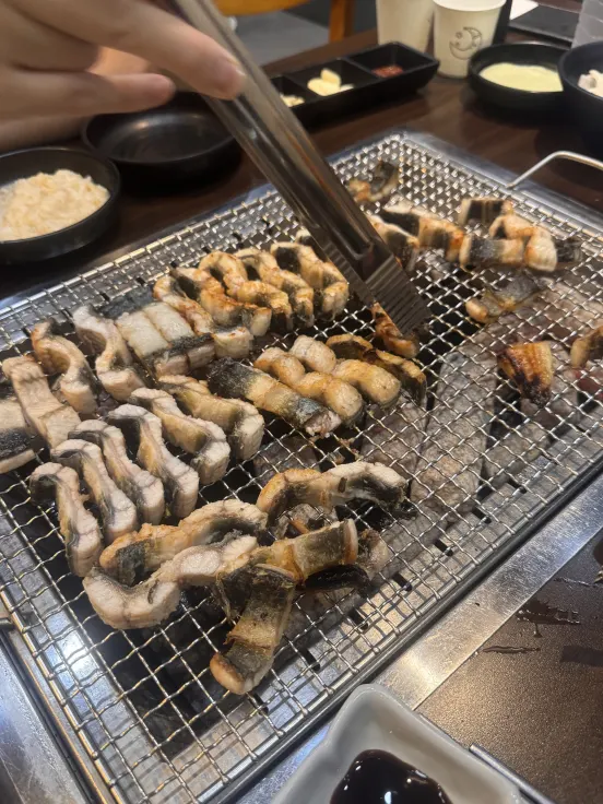 Close-up of eel while grilling